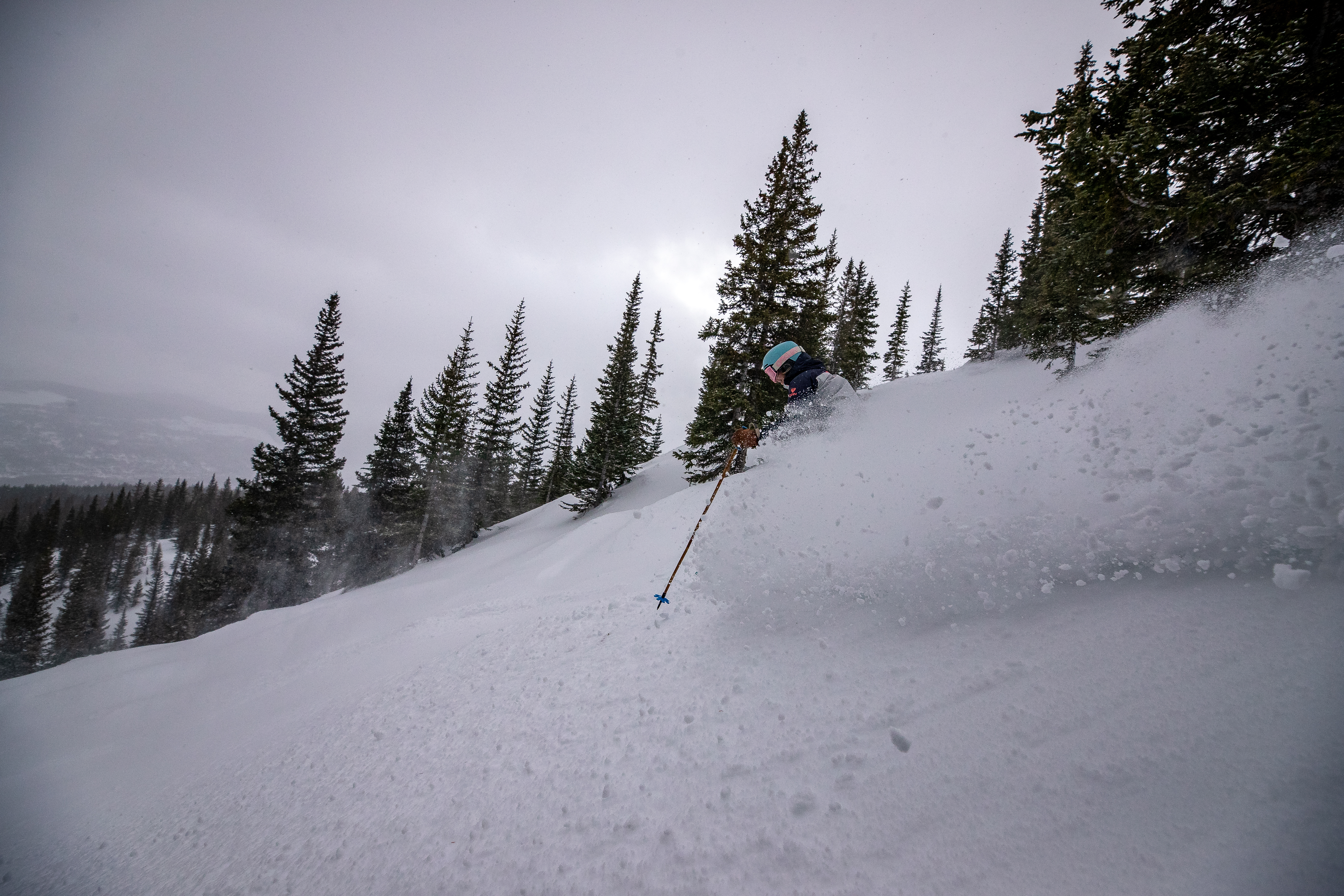 Friends ski and ride the trees at Breckenridge